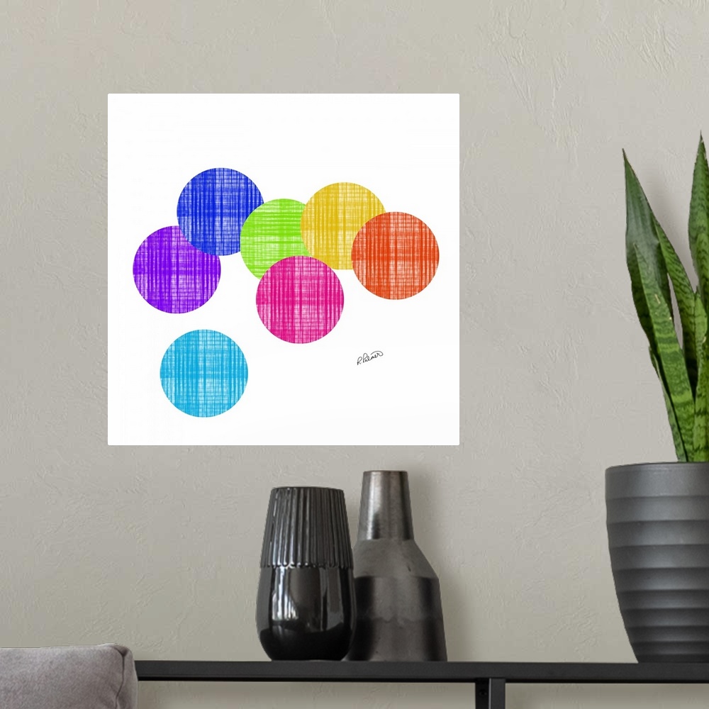 A modern room featuring Vibrant colored circles in a cross hatching pattern overlapping each other on a white backdrop.