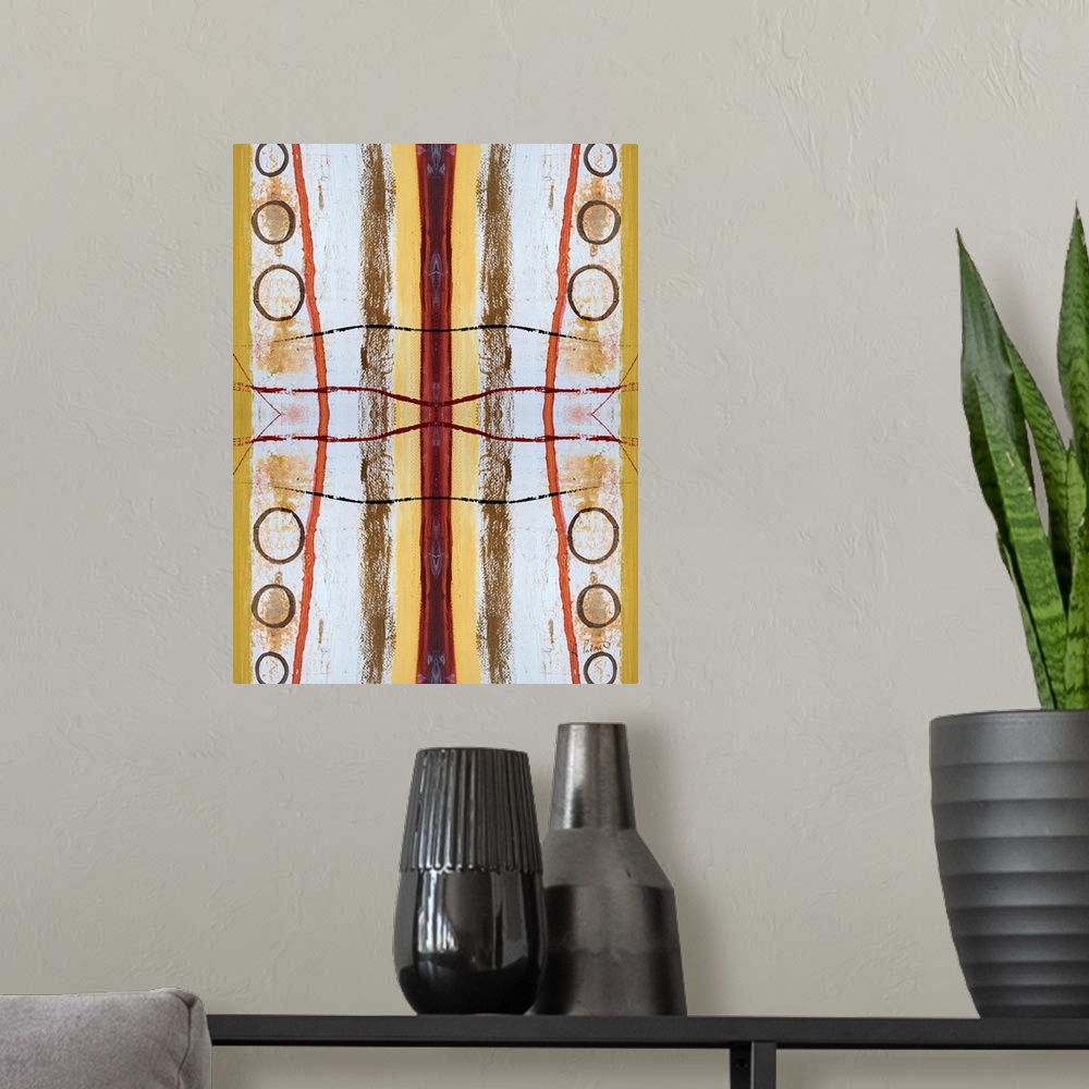 A modern room featuring Abstract contemporary painting resembling a kaleidoscopic image, in yellow, orange, and white tones.