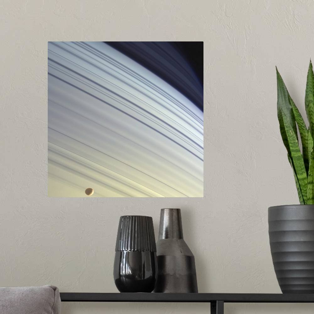 A modern room featuring Mimas drifts along in its orbit against the azure backdrop of Saturns northern latitudes