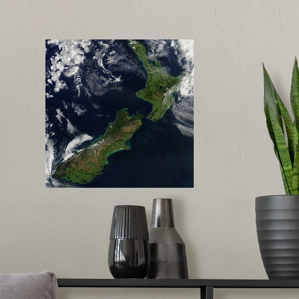 A modern room featuring March 30, 2011 - Satellite view of New Zealand. Near the top of the image, snow covers the highes...