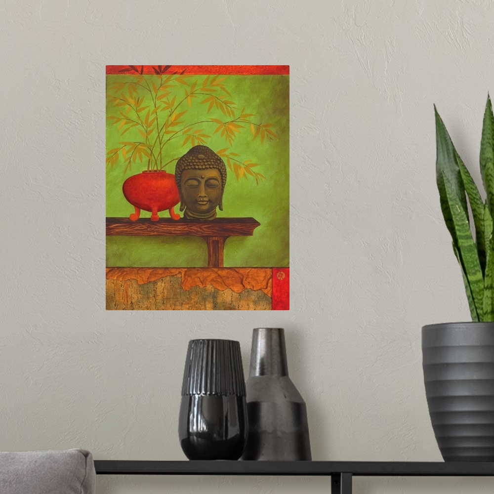 A modern room featuring Asian style artwork of a bust of Buddha on a shelf with a red vase full of bamboo.