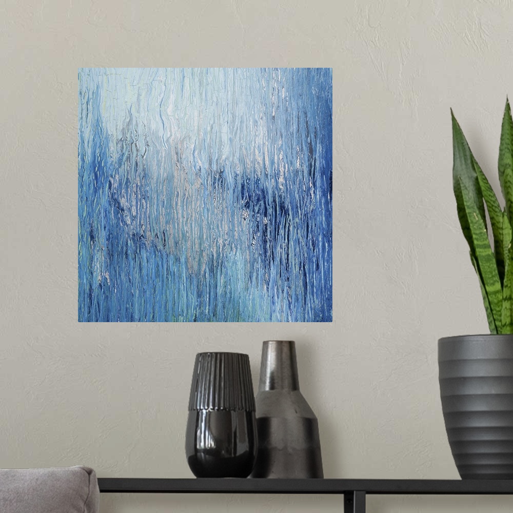 A modern room featuring Abstract artwork in shades of blue resembling glacial ice.