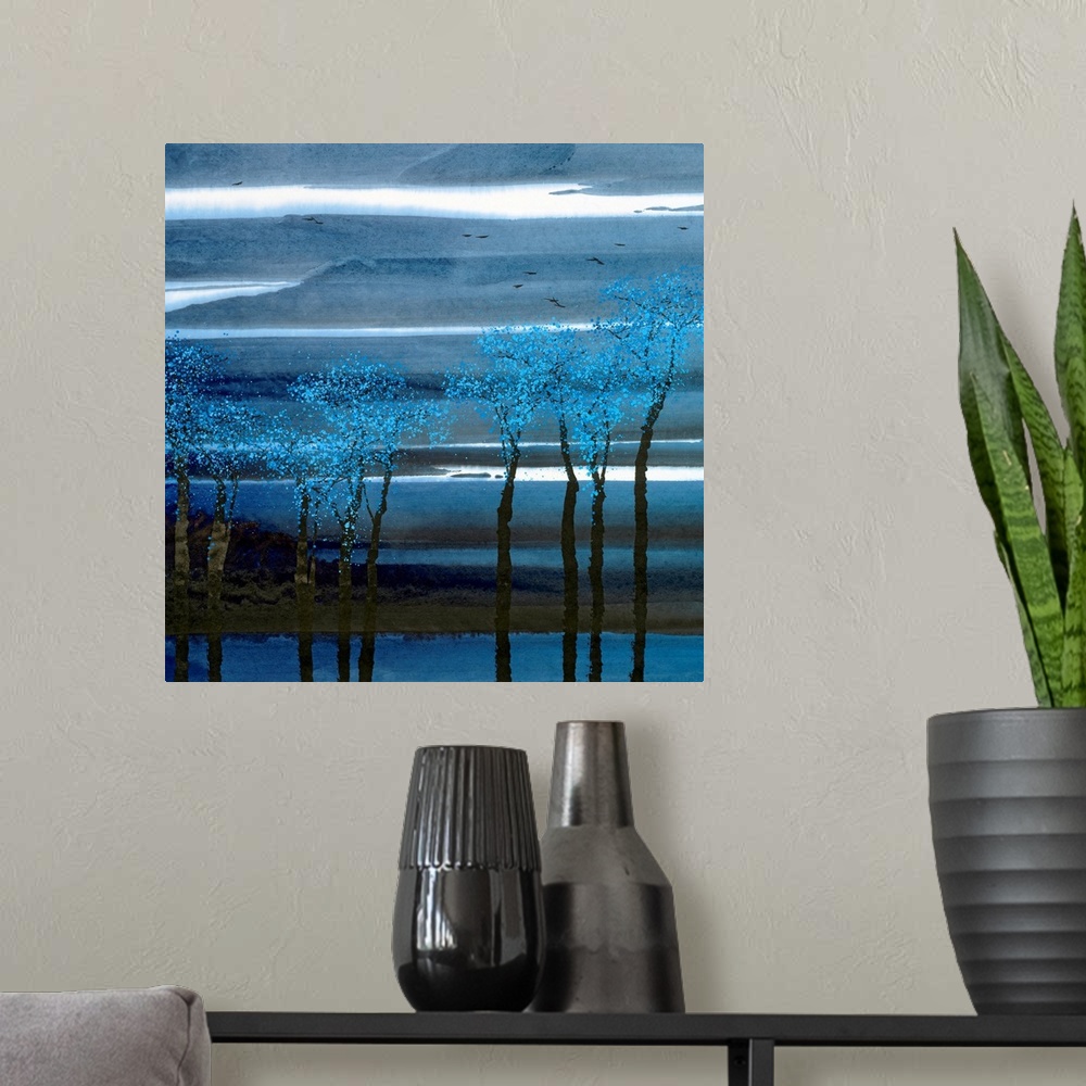 A modern room featuring A painting of trees with bright leaves planted along a waterfront with thin layers of clouds in t...
