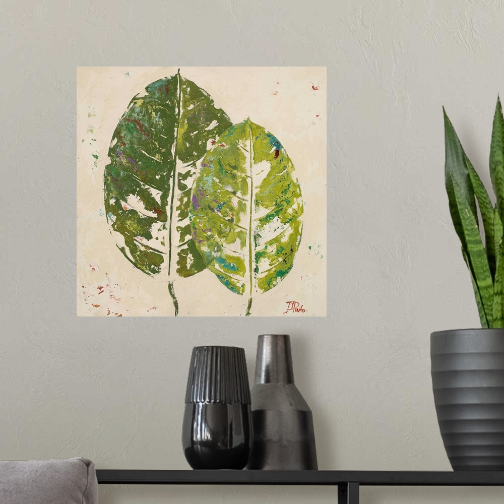 A modern room featuring Painting of green tropical leaves against a beige background.
