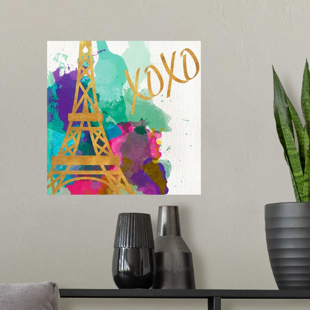A modern room featuring The Eiffel Tower in gold on multicolored watercolor splashes.