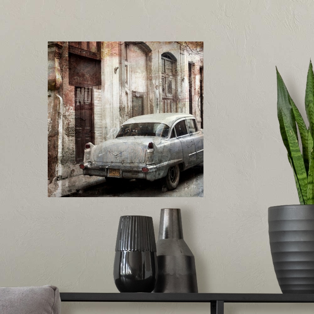 A modern room featuring Photograph of a vintage car parked on a street, next to decayed looking buildings.