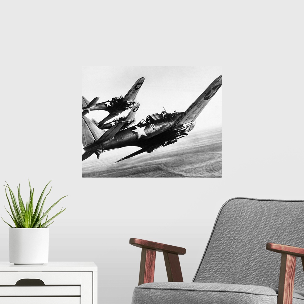 A modern room featuring Three U.S. Navy Douglas SBD 'Dauntless' dive bombers flying over the Pacific Ocean