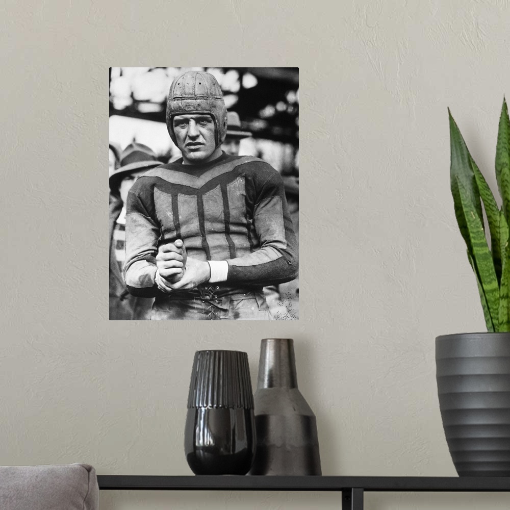A modern room featuring (1903-1991). American football player.