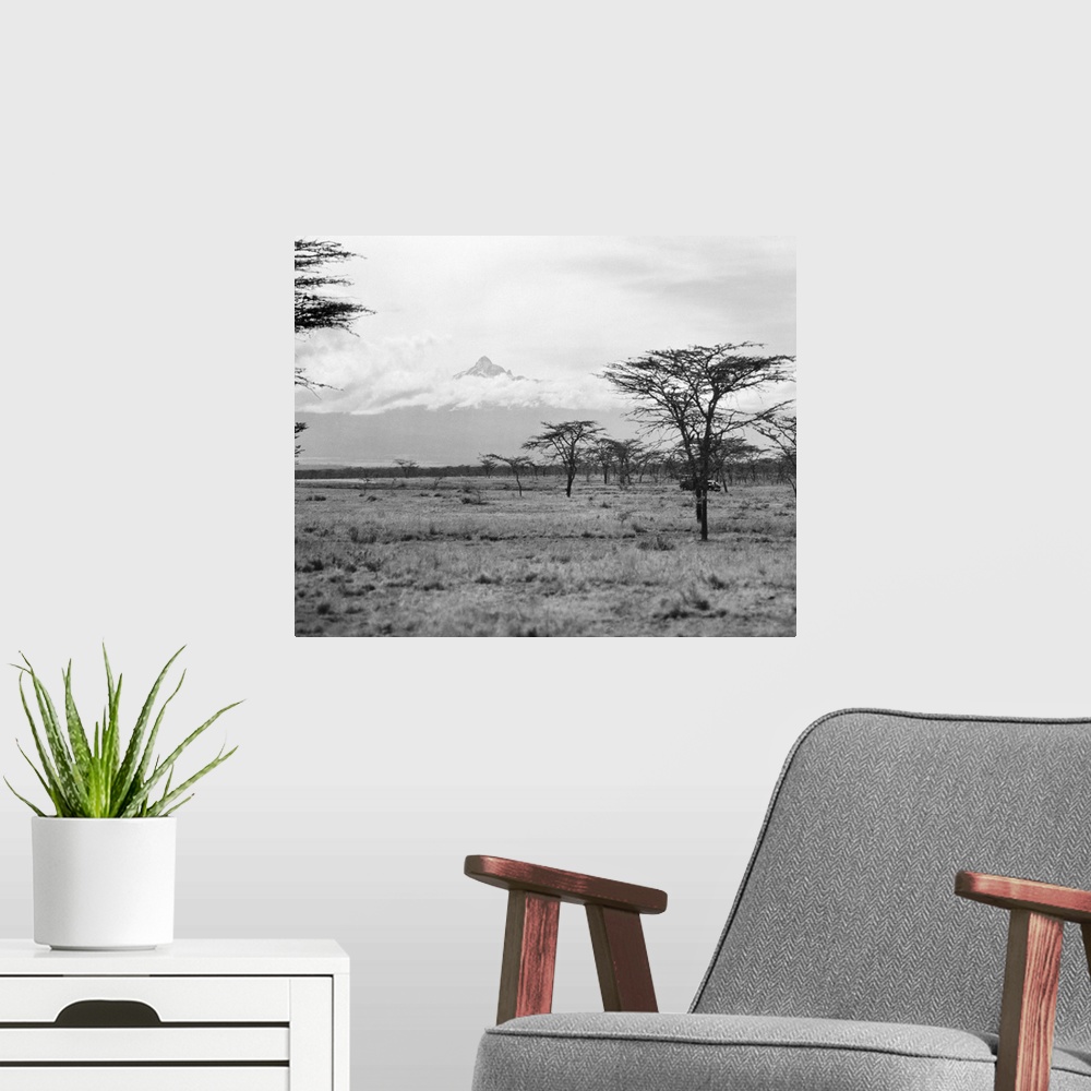 A modern room featuring Landscape view in Kenya, with Mount Kenya seen in the distance. Photographed in 1936.