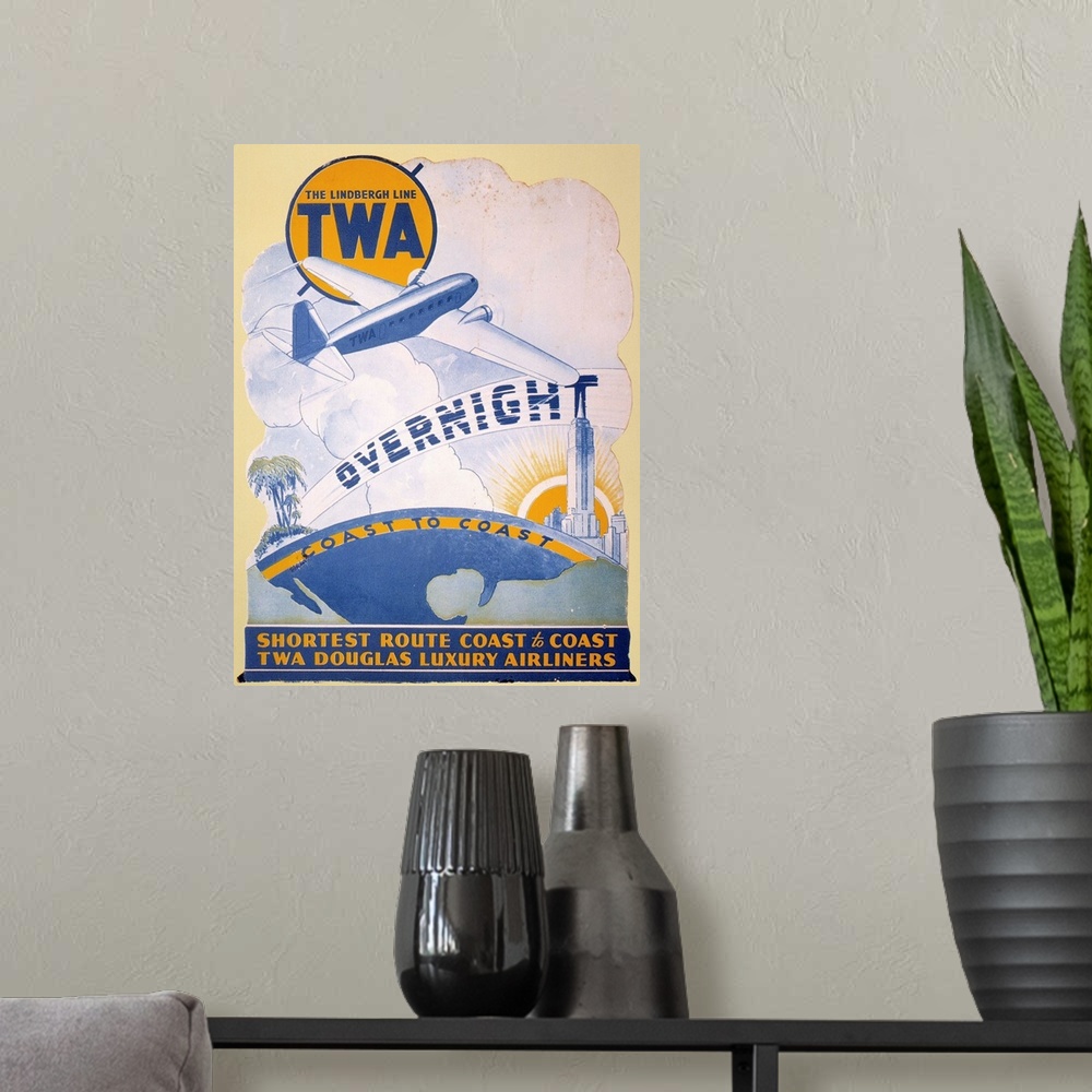 A modern room featuring A 1934 Trans-World Airlines poster introducing the new Douglas DC-2 on transcontinental routes.