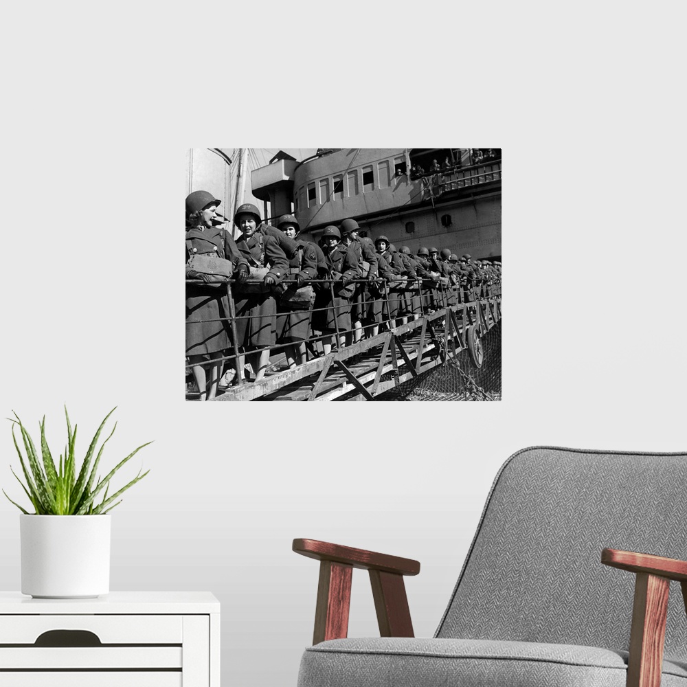 A modern room featuring Members of the Women's Army Corps disembark at a North African port during World War II. Among th...