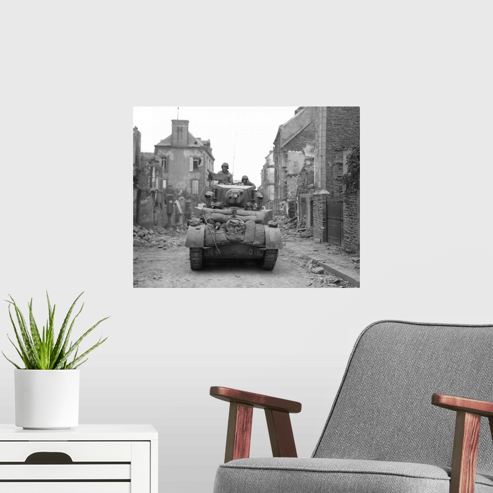 A modern room featuring An American tank moving through liberated Saint-Lo, Normandy, France, July 20, 1944.