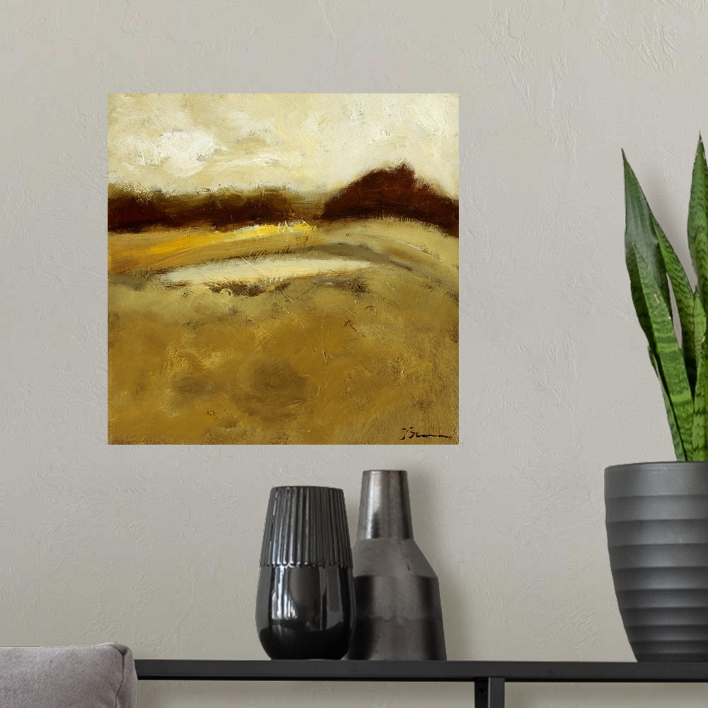 A modern room featuring Contemporary painting of a golden earthy toned landscape.
