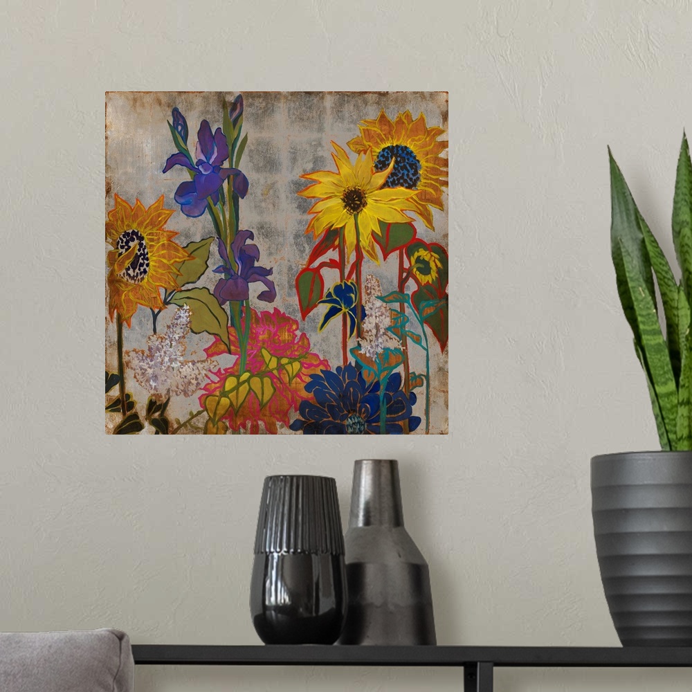 A modern room featuring A square painting of primary colored wild flowers in a garden with a silver square patterned back...