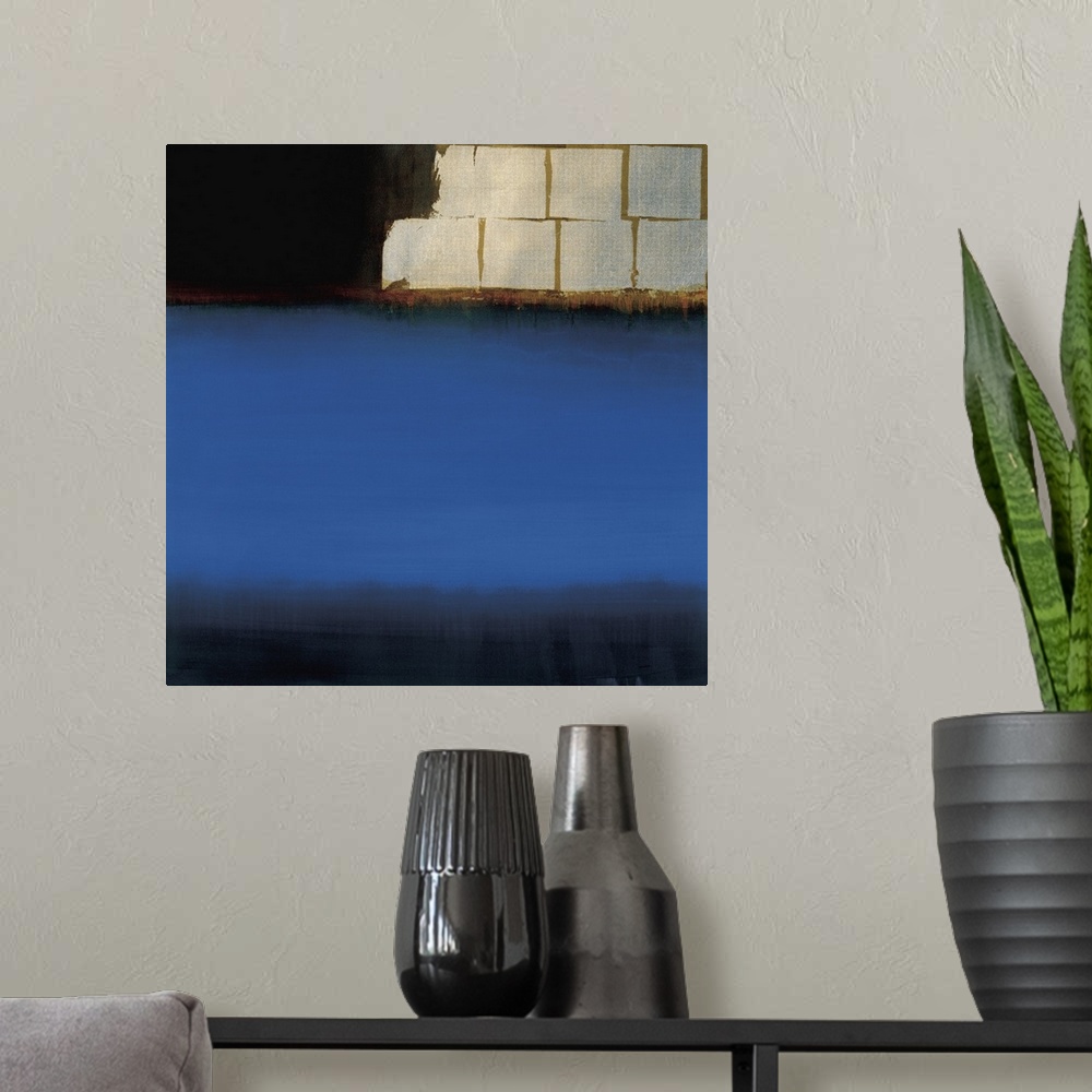A modern room featuring Contemporary abstract painting using deep blue to make what almost looks like an ocean.