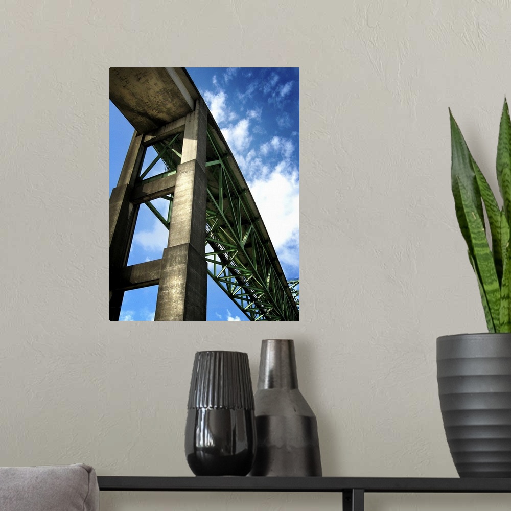 A modern room featuring A high rail bridge against a blue sky