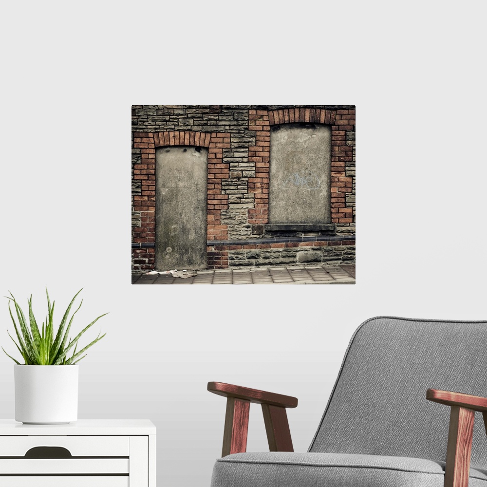 A modern room featuring Concreted in derelict doorway and window