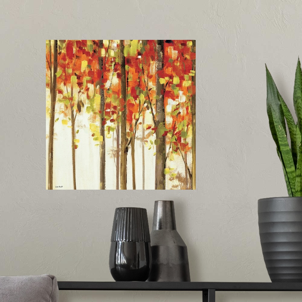 A modern room featuring Contemporary painting of tree tops covered in fall colored foliage.