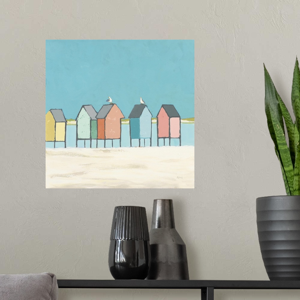 A modern room featuring Decorative artwork of colorful sea shacks at the beach with two seagulls.