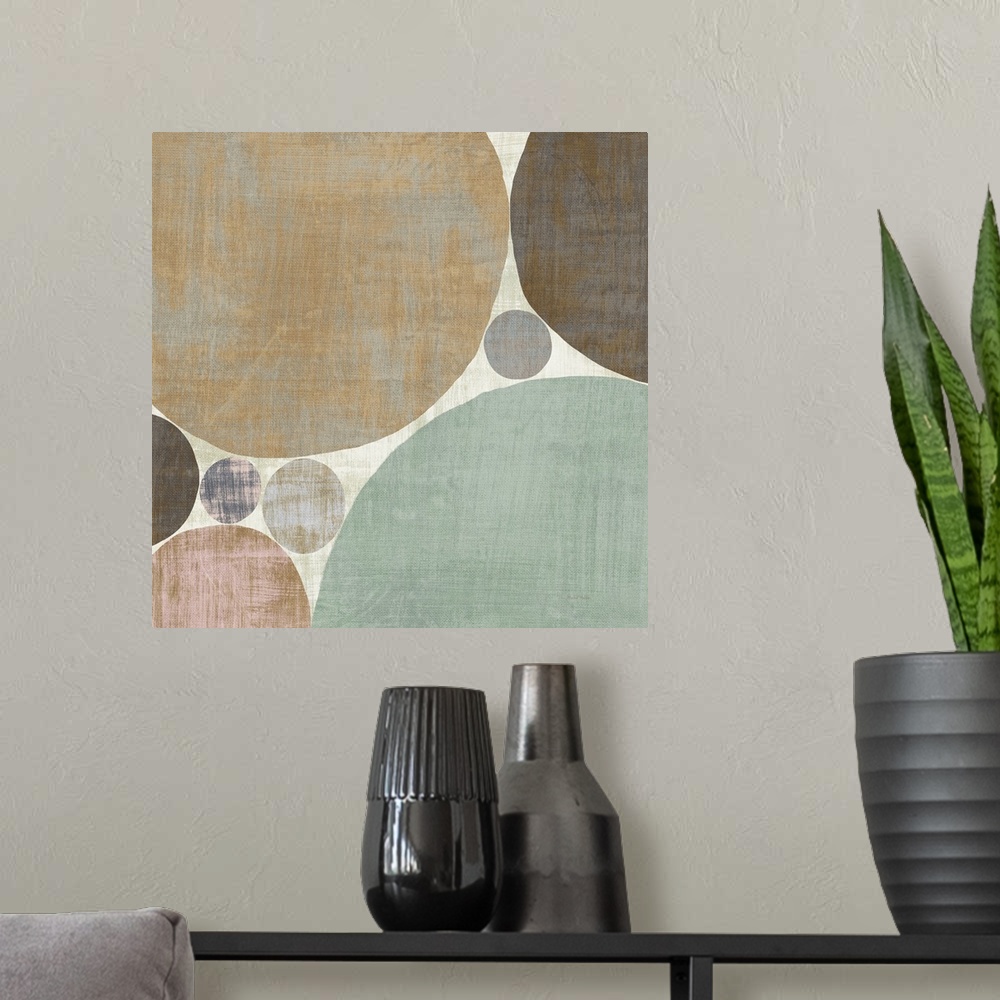 A modern room featuring Abstract artwork with different sized circular shapes with a weathered look.