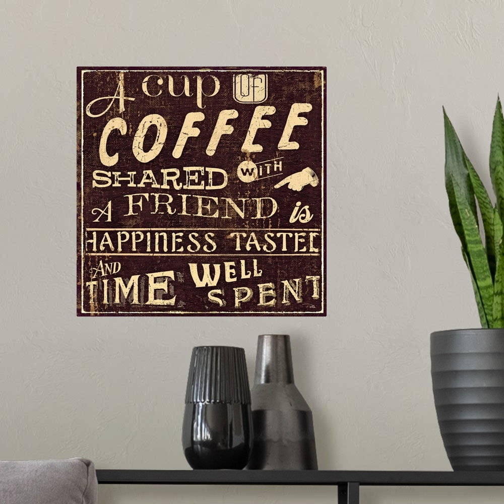 A modern room featuring Vintage cafo artwork with the text "A cup of coffee shared with a friend is happiness tasted and ...