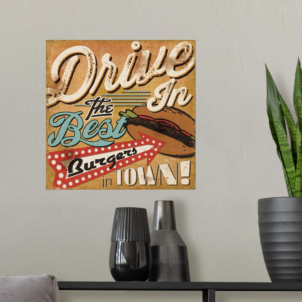 A modern room featuring Retro style sign for a drive in, with an arrow pointing to a burger.