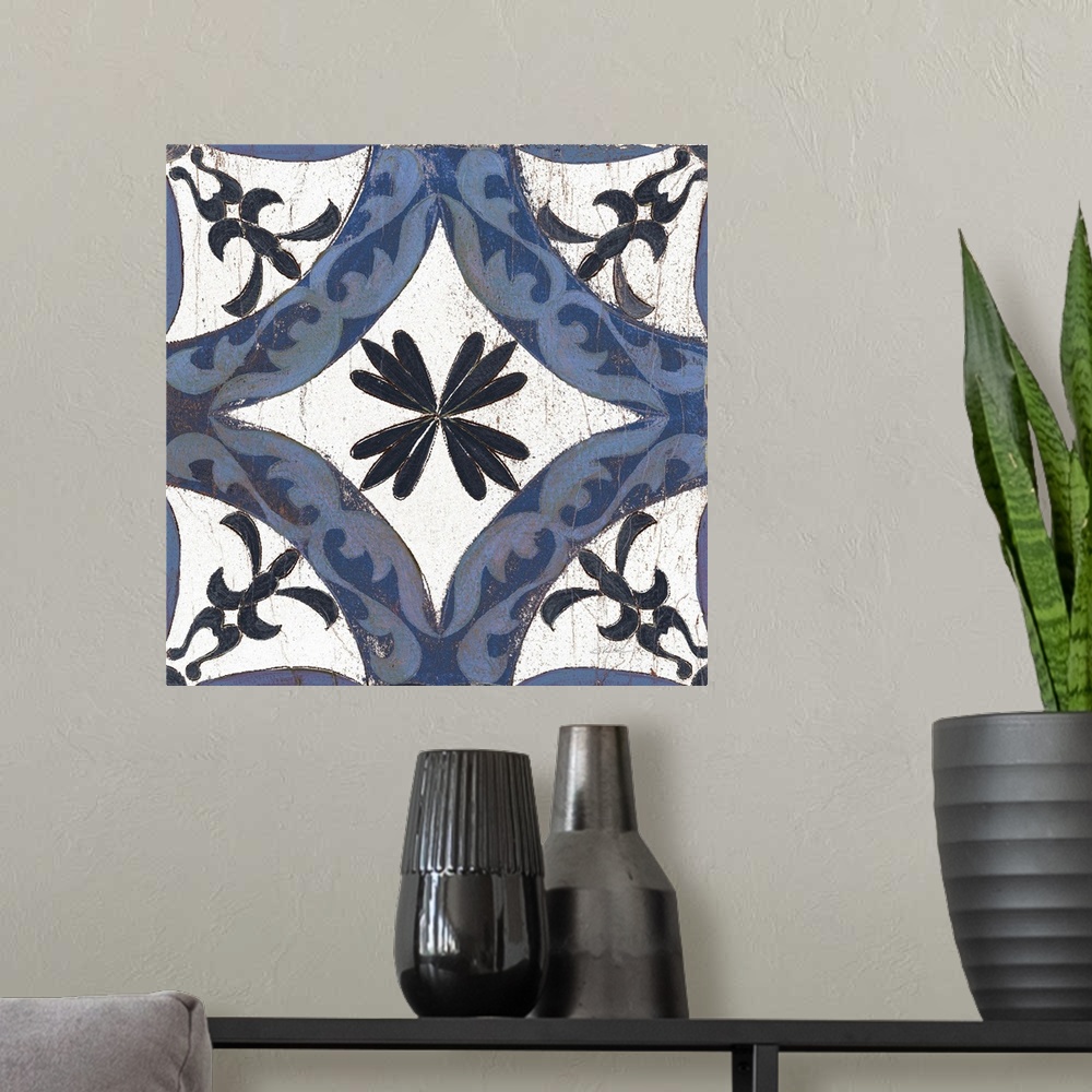 A modern room featuring Square abstract painting of a symmetric indigo and white tile-like design.