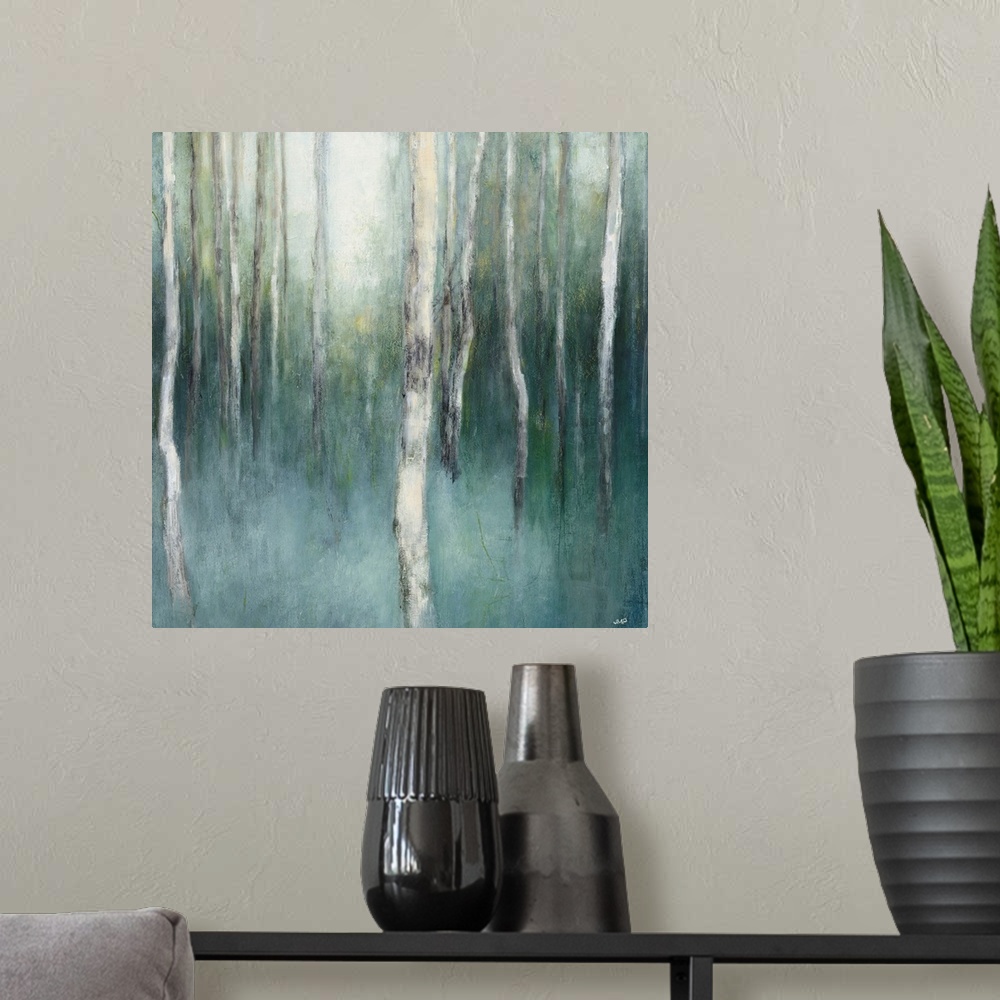 A modern room featuring Square abstract painting of birch trees in a blue and green misted forest.