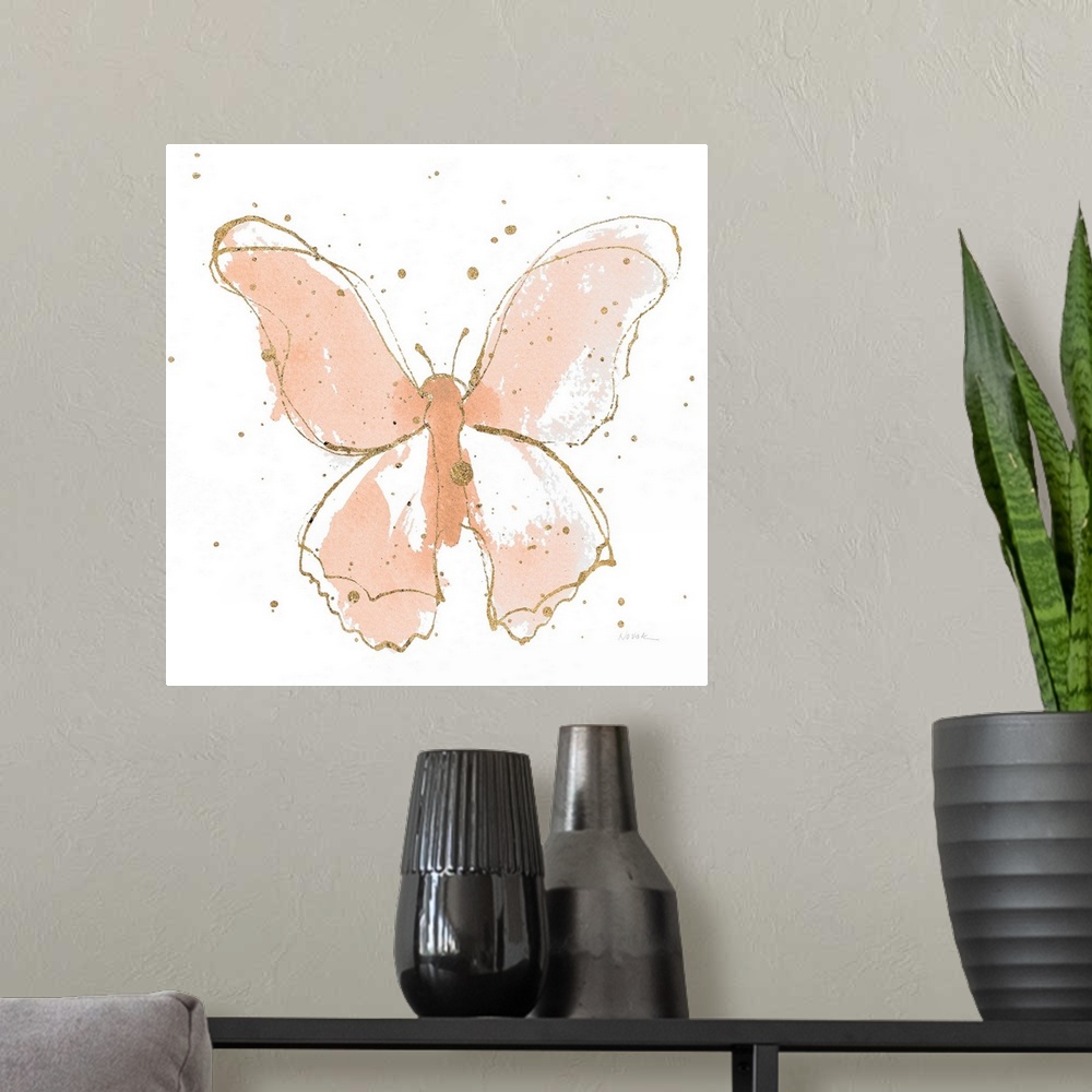 A modern room featuring A square watercolor painting of a peach butterfly outlined in gold with gold splatters.