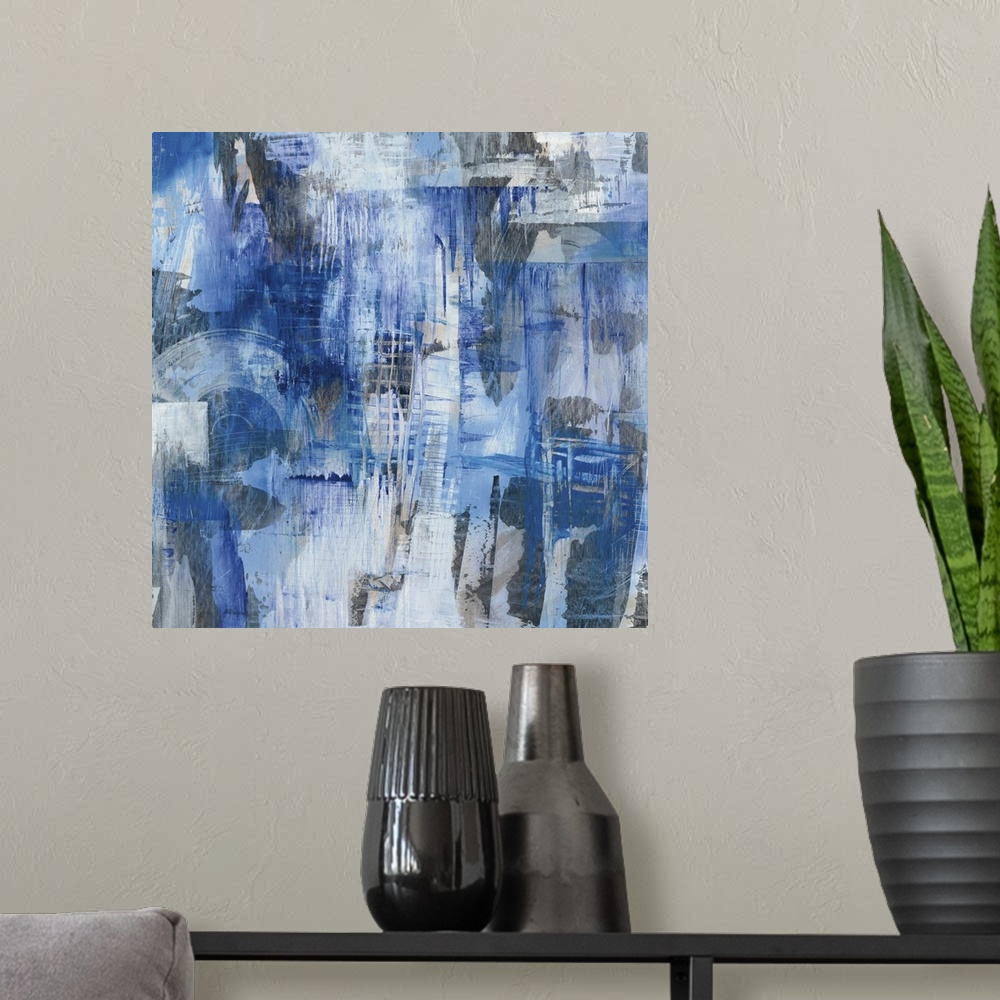 A modern room featuring Square abstract painting with blue, gray, and white hues creating different shapes and layers of ...