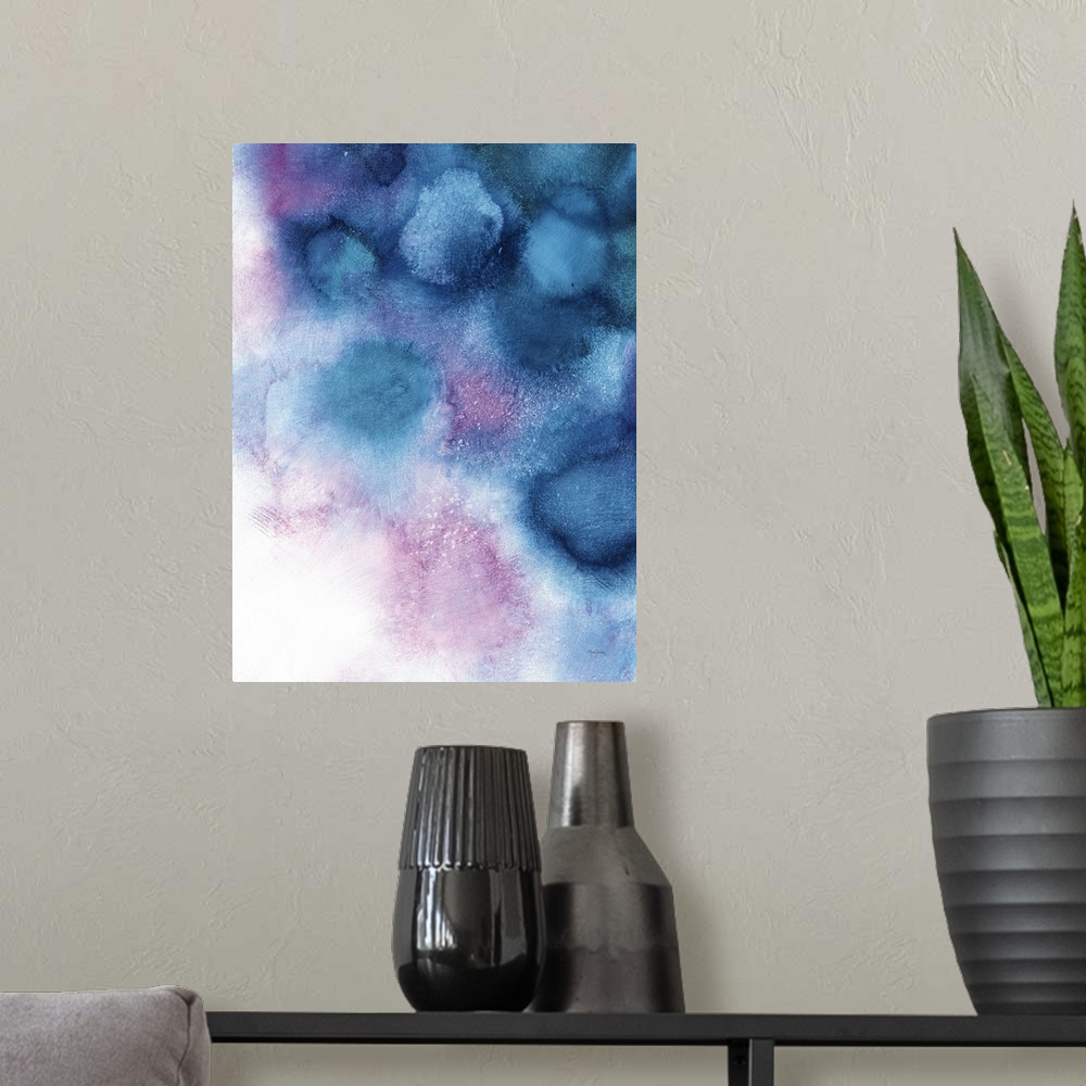 A modern room featuring Large abstract painting in blue and purple tones representing space nebula on a white background.