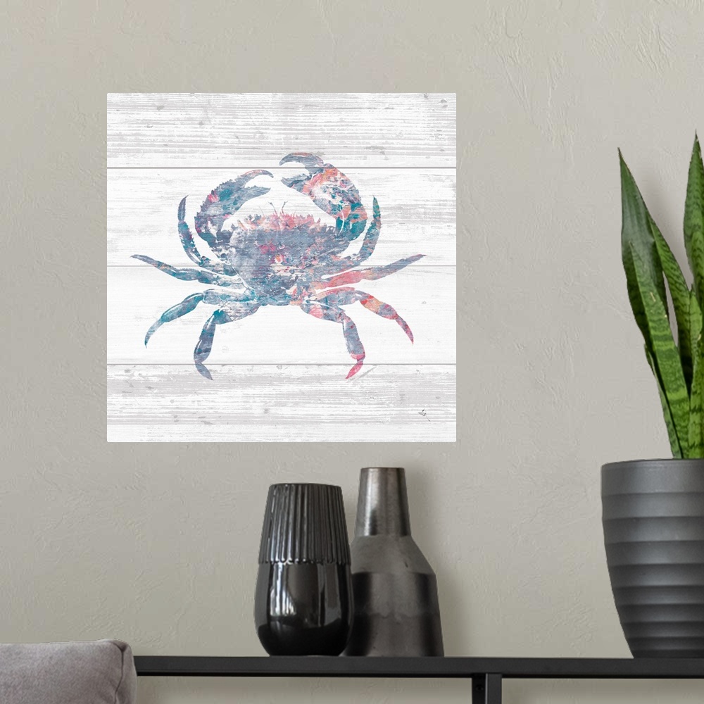 A modern room featuring Square beach decor with a silhouette of a blue, pink, red, and white crab on a rustic, white, woo...