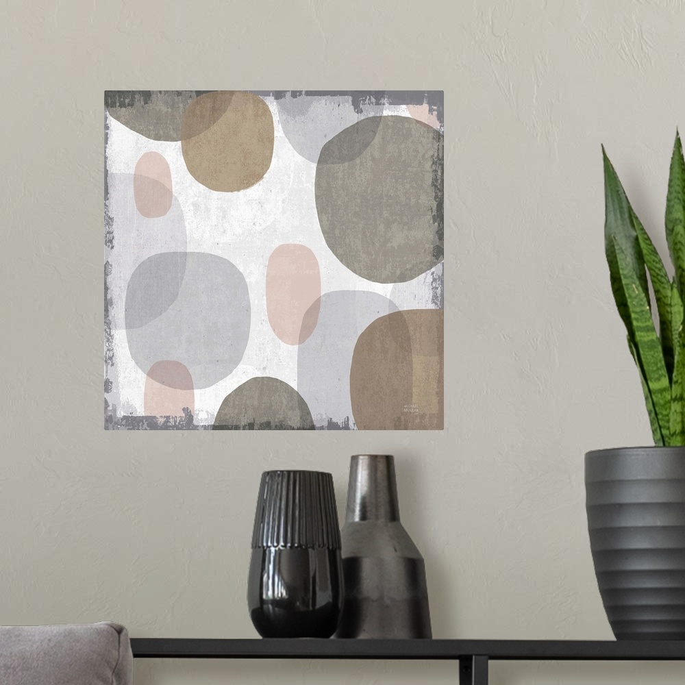 A modern room featuring Large abstract artwork with oblong shapes running down the canvas in brown, gray, faded pink, and...