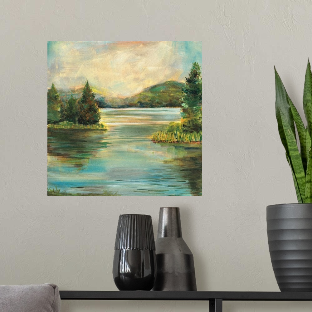 A modern room featuring Contemporary landscape painting of a lake at sunset with rolling hills in the distance.