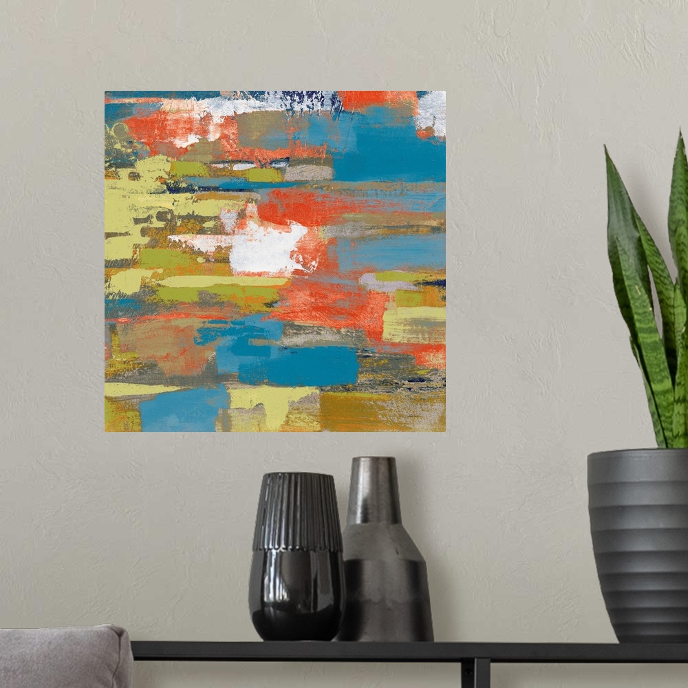 A modern room featuring Large abstract painting made with shades of green, blue, gray, orange, and white on a square canvas.