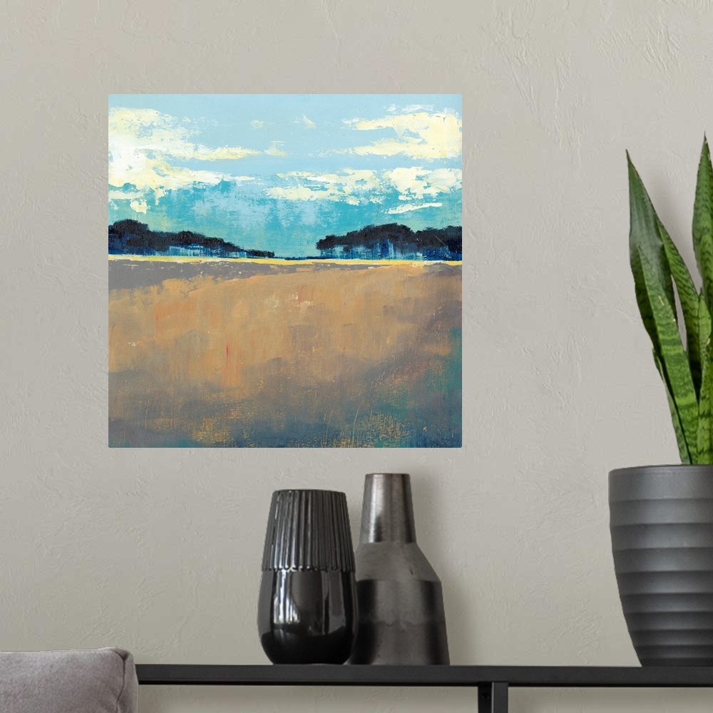 A modern room featuring Contemporary painting of landscape with dark trees in the flat landscape under a blue sky.