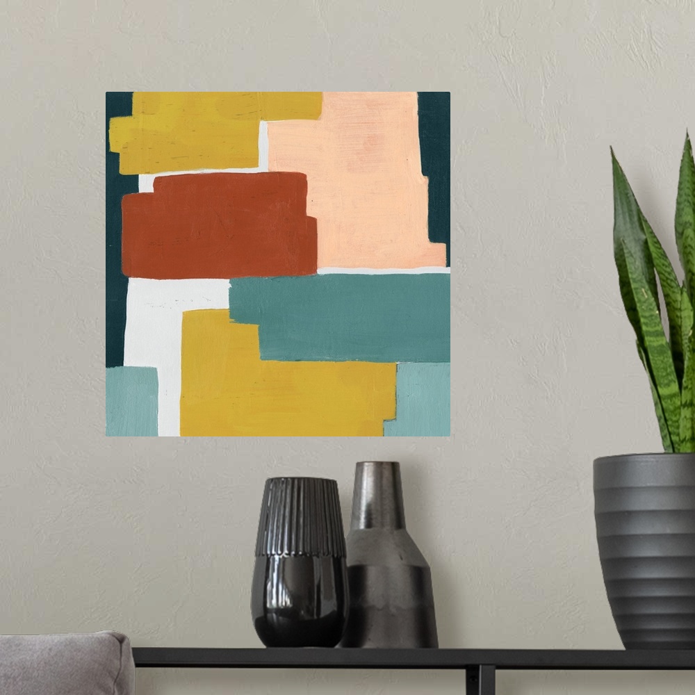 A modern room featuring Contemporary artwork featuring blocks of color in shades of orange, yellow and blue-green.
