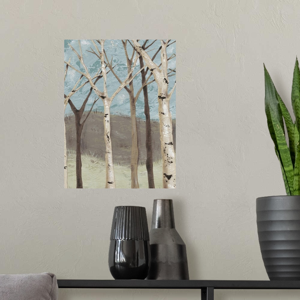 A modern room featuring Contemporary painting of bare branched birch trees against a blue and brown background.