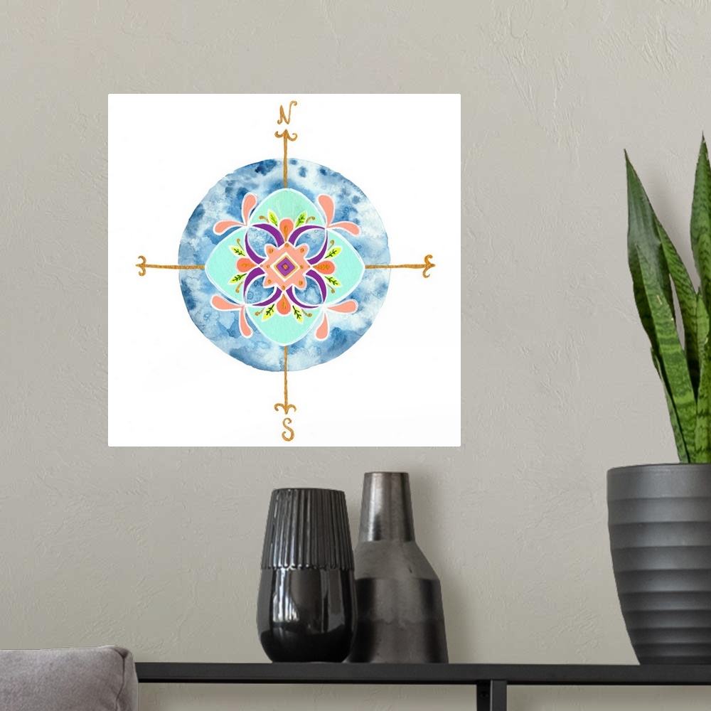 A modern room featuring Decorative compass with a leaf mandala-like pattern over a circular watercolor blue background.