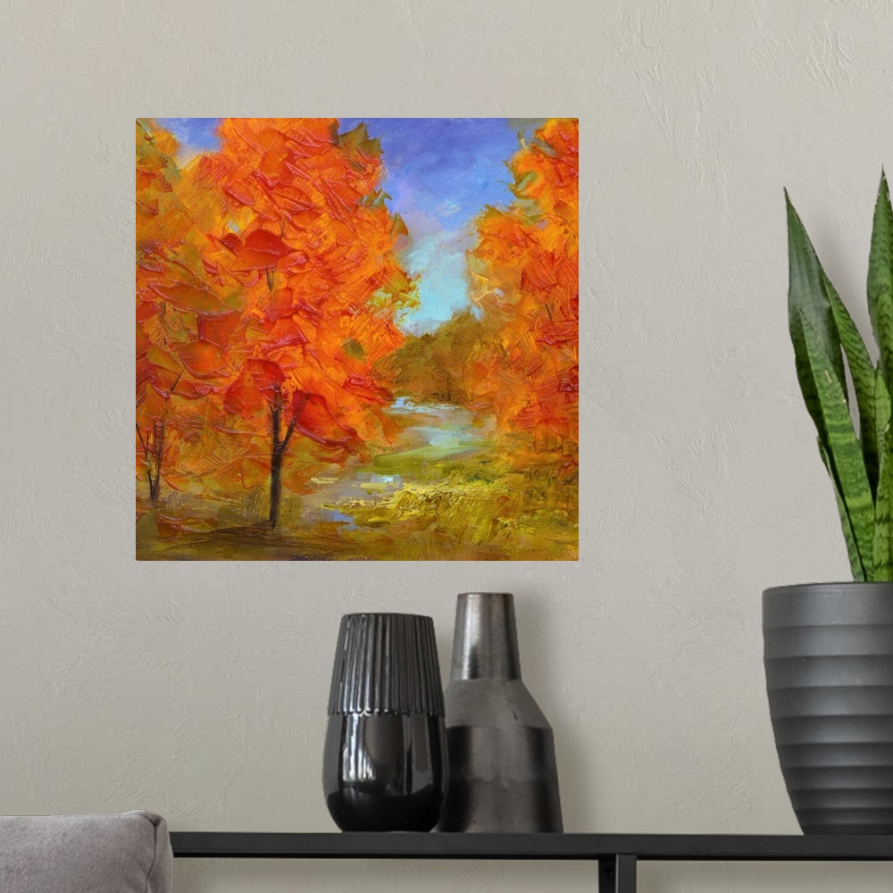 A modern room featuring Contemporary artwork of a grove of trees with bright orange leaves.
