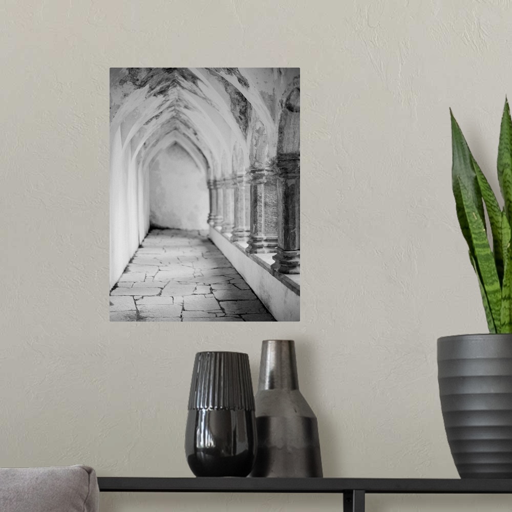 A modern room featuring Black and white photograph of the outside walkway of a cathedral, Ireland.