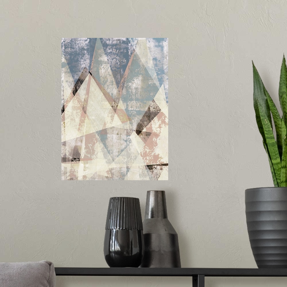 A modern room featuring Abstract artwork of triangular shapes with a weathered texture.