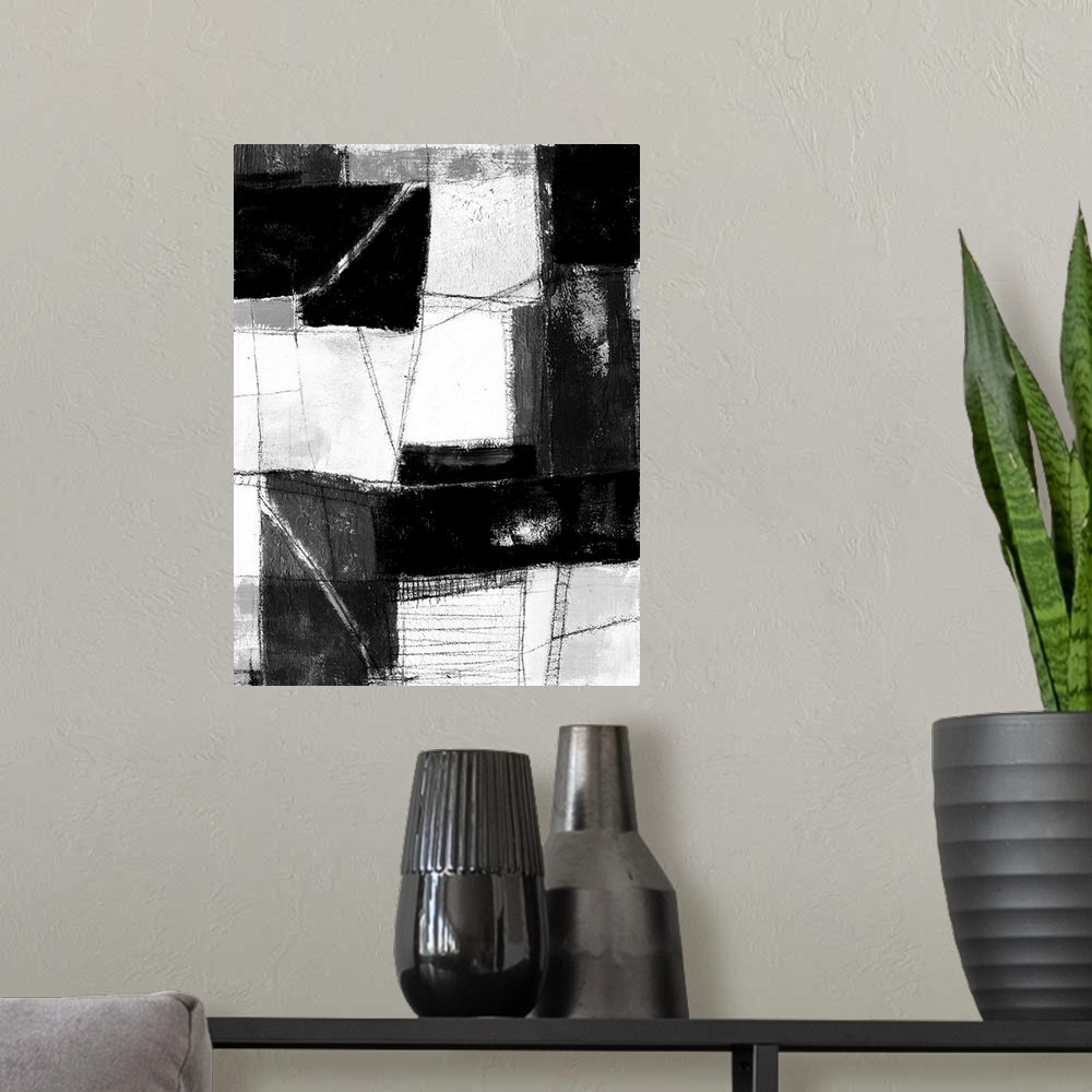 A modern room featuring Contemporary abstract painting made of white and black blocks.