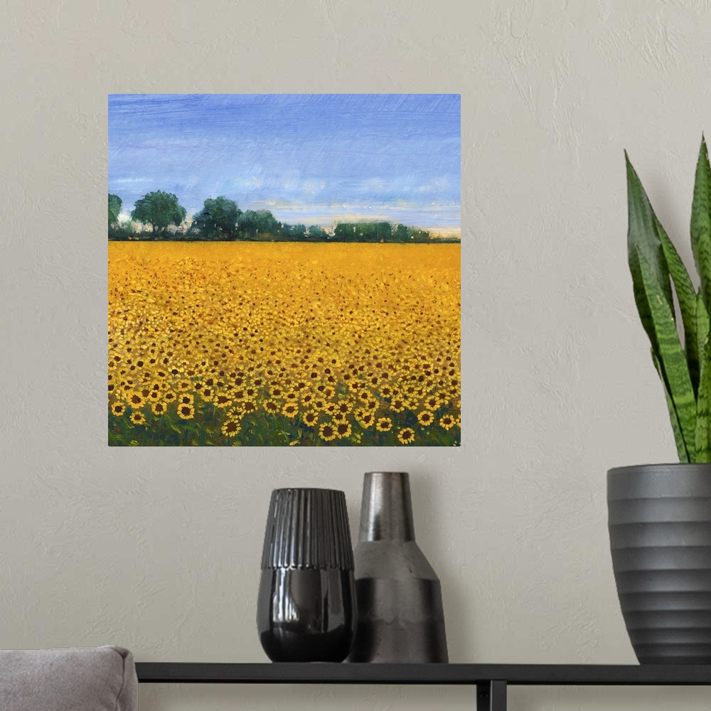 A modern room featuring Contemporary painting of a field of yellow sunflowers under a blue sky.