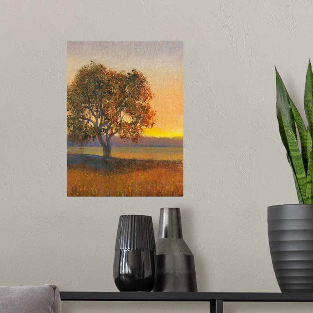 A modern room featuring Contemporary landscape painting of a lone tree in a meadow at sunset.
