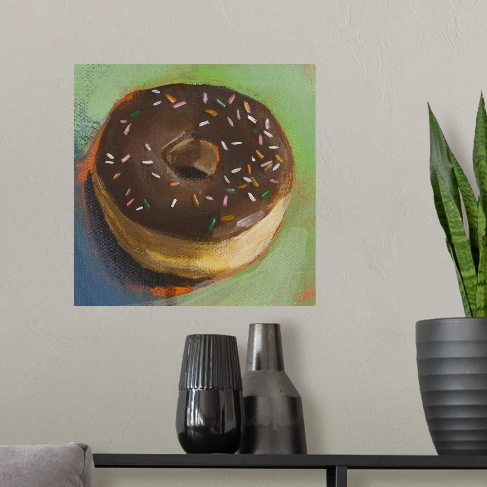 A modern room featuring Contemporary painting of a chocolate frosted donut on a green plate.