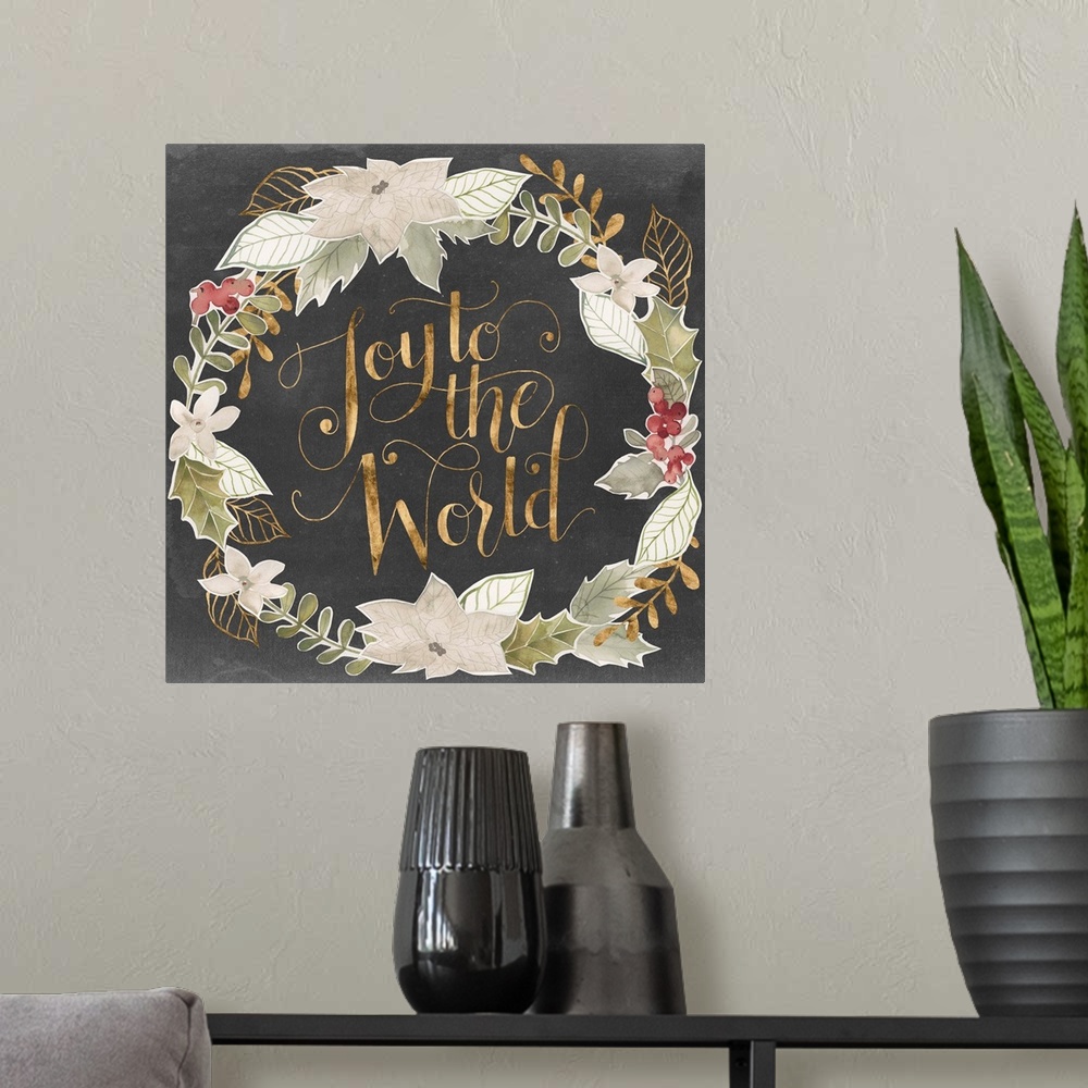 A modern room featuring "Joy To The World" in gold surrounded by a wreath of muted green shades with gold accents.