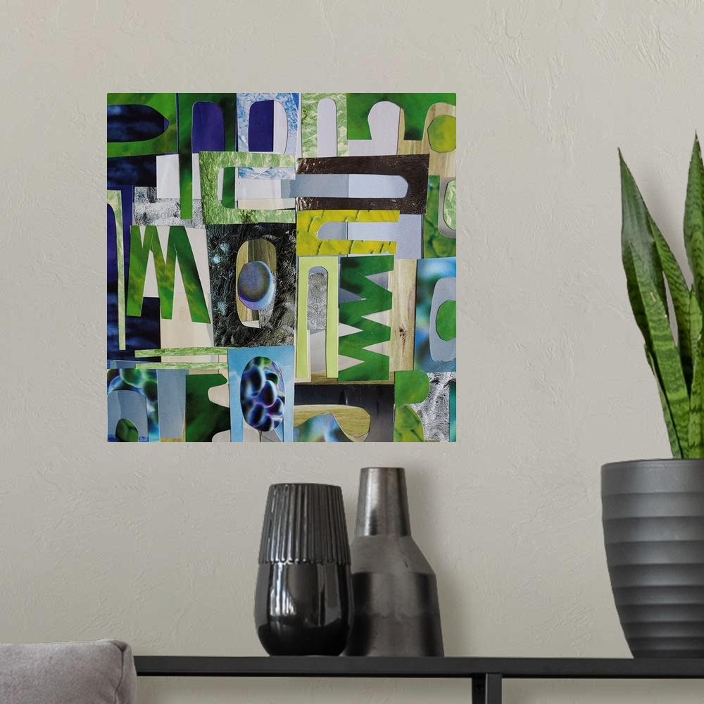 A modern room featuring A mixed media piece featuring cut out paper shapes in shades of blue, green and grey