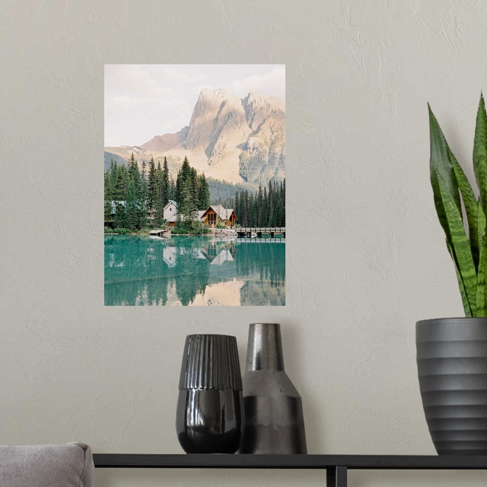 A modern room featuring Photograph of Emerald Lake Lodge and surrounding trees reflected in Moraine Lake, Banff, Canada.