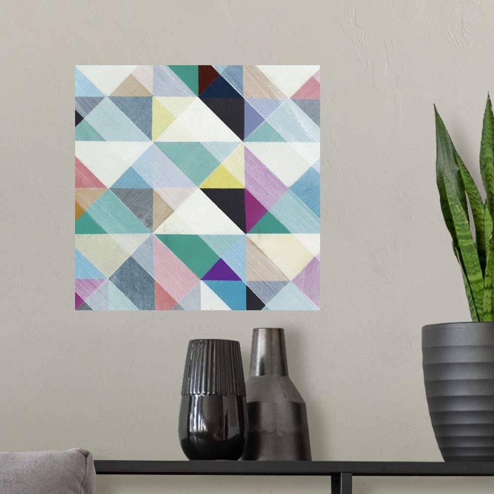 A modern room featuring Contemporary colorful patterned artwork using geometric shapes.